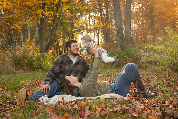 Family fun in autumn leaves - family photography in Breezy Point, Minnesota