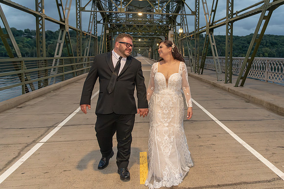 Bride and Groom walking on the lift bridge in Stillwater, Minnesota