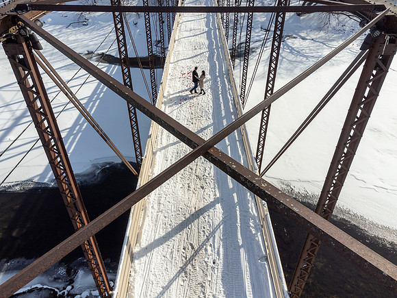 Surprise engagement on the Hanover Bridge in Hanover, Minnesota