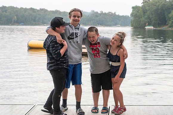 Sibling fun on the dock at the family cabin in Emily, Minnesota - Butterfield Lake