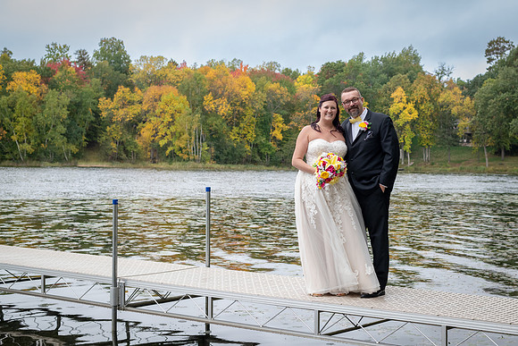 Bride and groom portrait on the dock in Fifty Lakes, Minnesota - Butterfield Lake