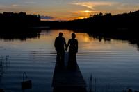 Bride and groom lake sunset silhouette on the dock in Emily, Minnesota - Minnie Lake