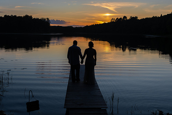 Bride and groom lake sunset silhouette on the dock in Emily, Minnesota - Minnie Lake