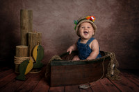 6 month portrait of a little boy in a wooden fishing boat - fishing theme portrait - Emily, MN